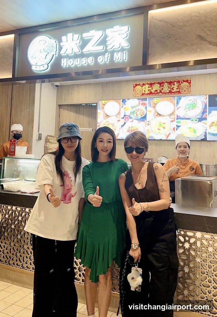 Three women posing in a restaurant