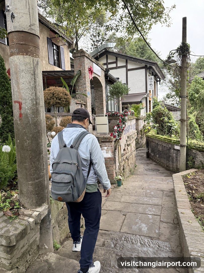 Man walking on stone path near shop entrance