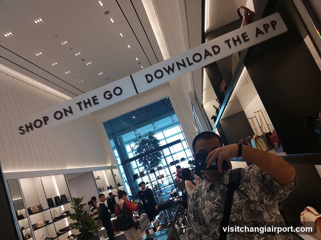 Shopping Mall Interior with App Promotion Signage