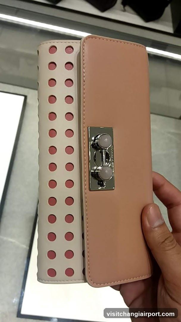 Handheld clutch purse with perforated design