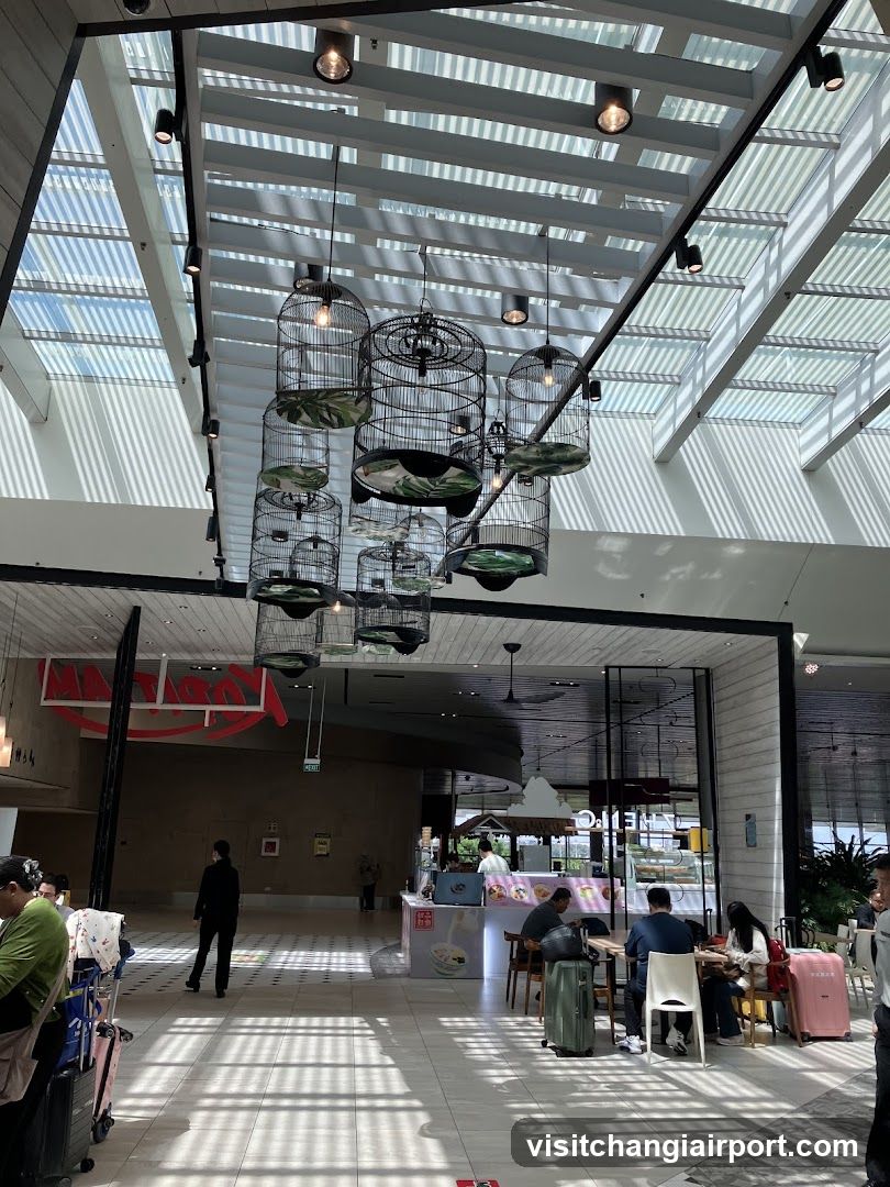 Interior of a modern building with hanging birdcages