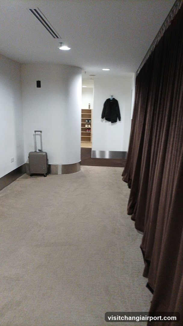 Interior hallway with luggage and coat rack