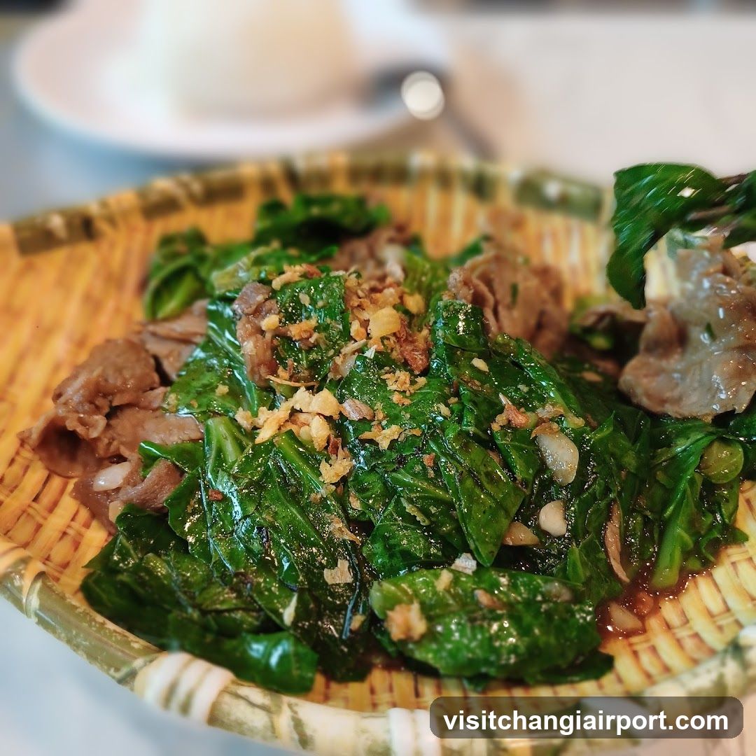 Stir-fried greens with minced garlic and meat