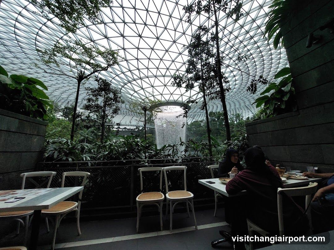Indoor Dining Area with Waterfall View