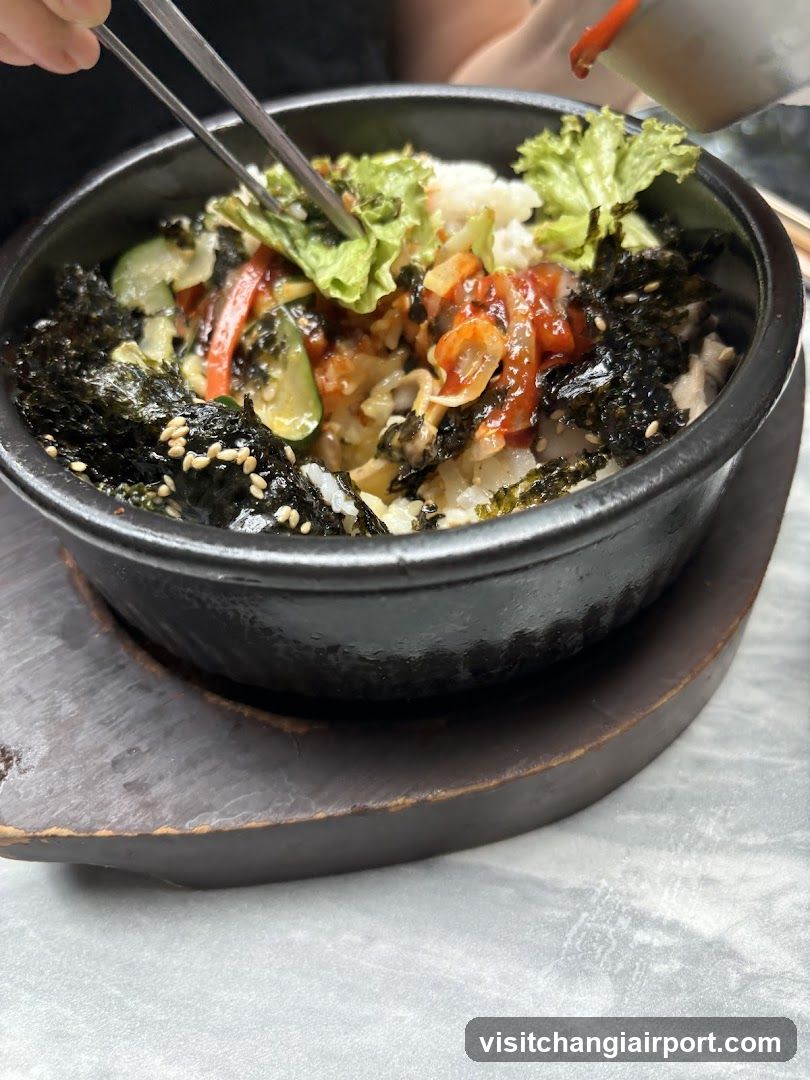 Bowl of Korean-style rice with vegetables and seaweed