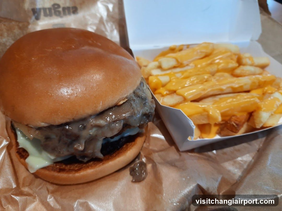 Burger and Fries with Cheese Sauce
