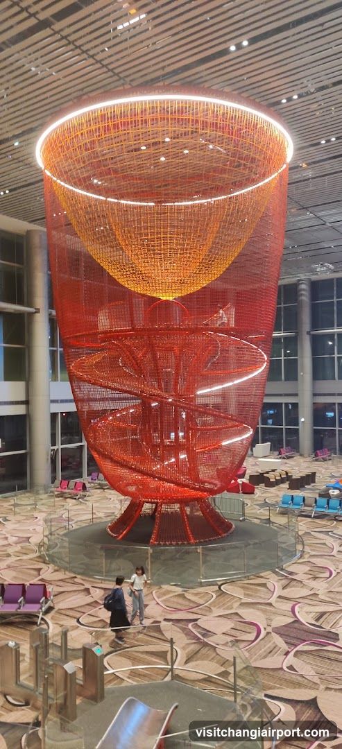 Large Red Sculpture in Airport Terminal