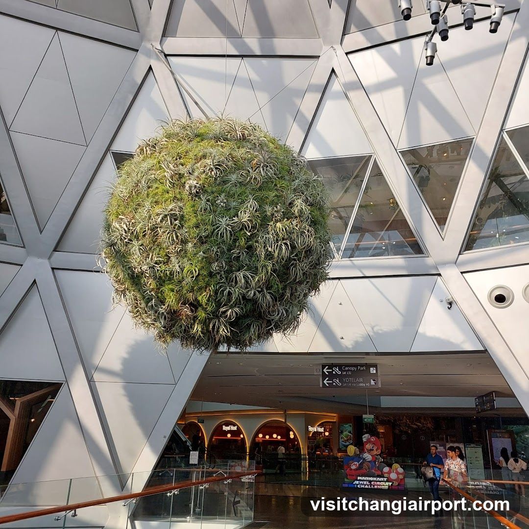 Suspended Green Sphere in Modern Interior