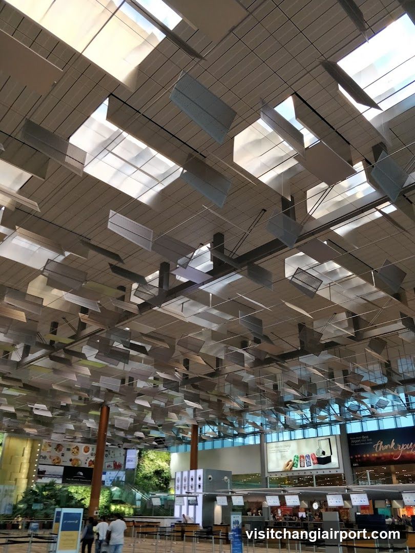 Airport Terminal Interior with Hanging Artwork