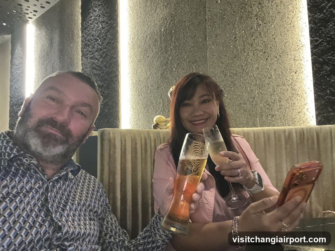 Two people toasting in a bar or lounge