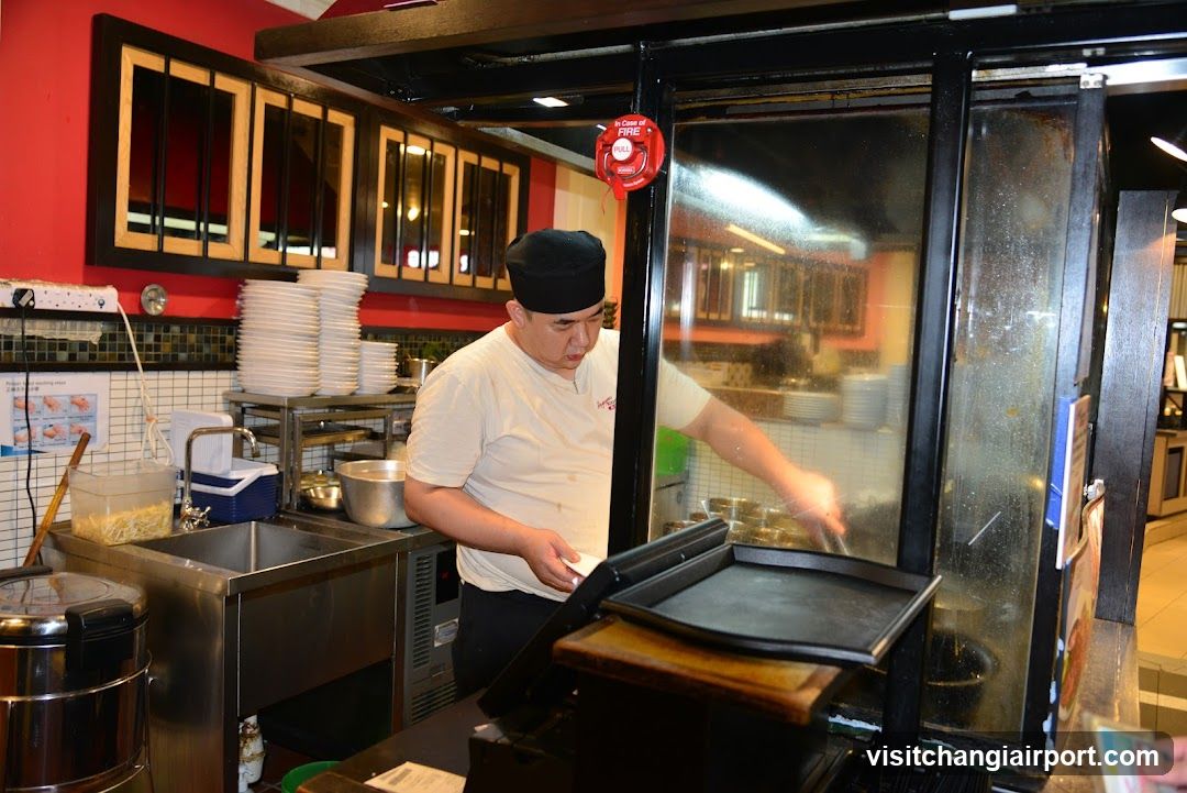 Chef Cooking in Kitchen