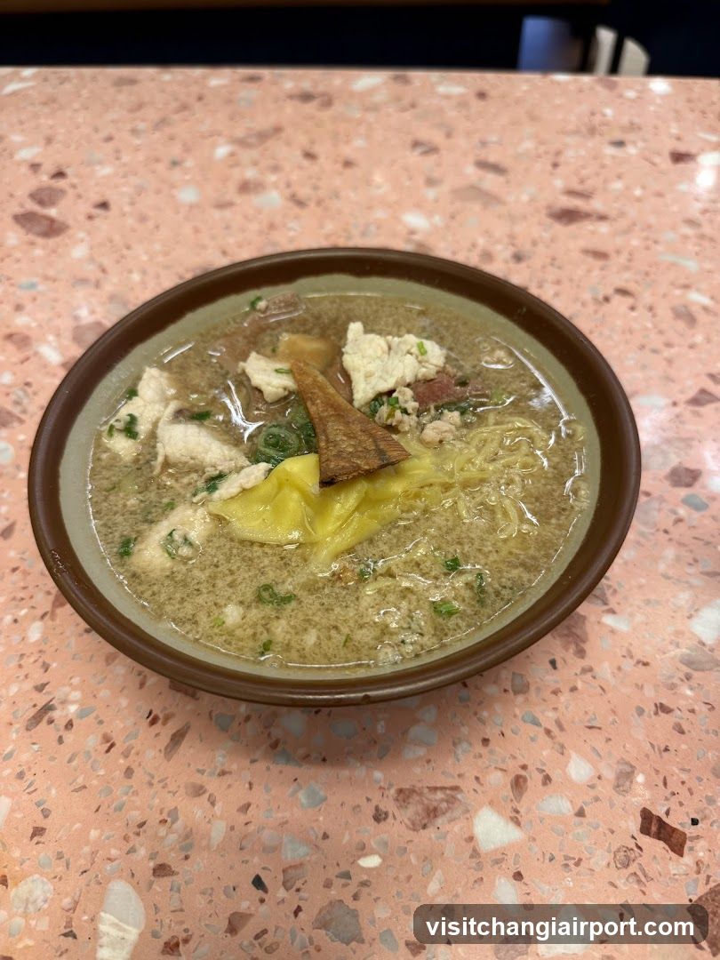 Bowl of Noodle Soup with Egg and Meat