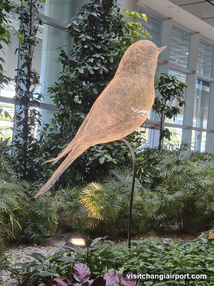 Woven Bird Sculpture in Garden Setting