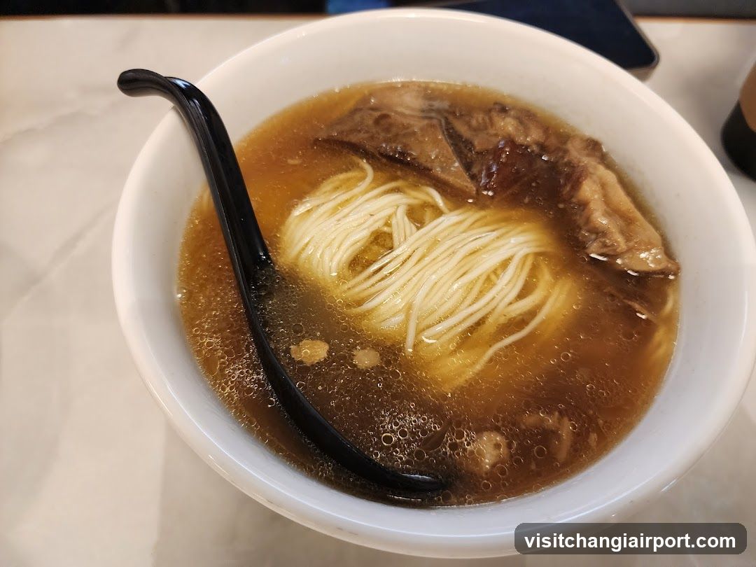 Bowl of Noodle Soup with Black Chopsticks