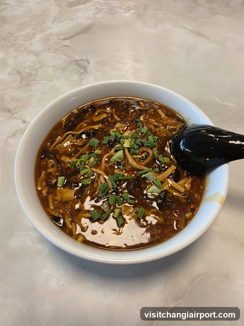 Bowl of Spicy Noodles with Green Onions
