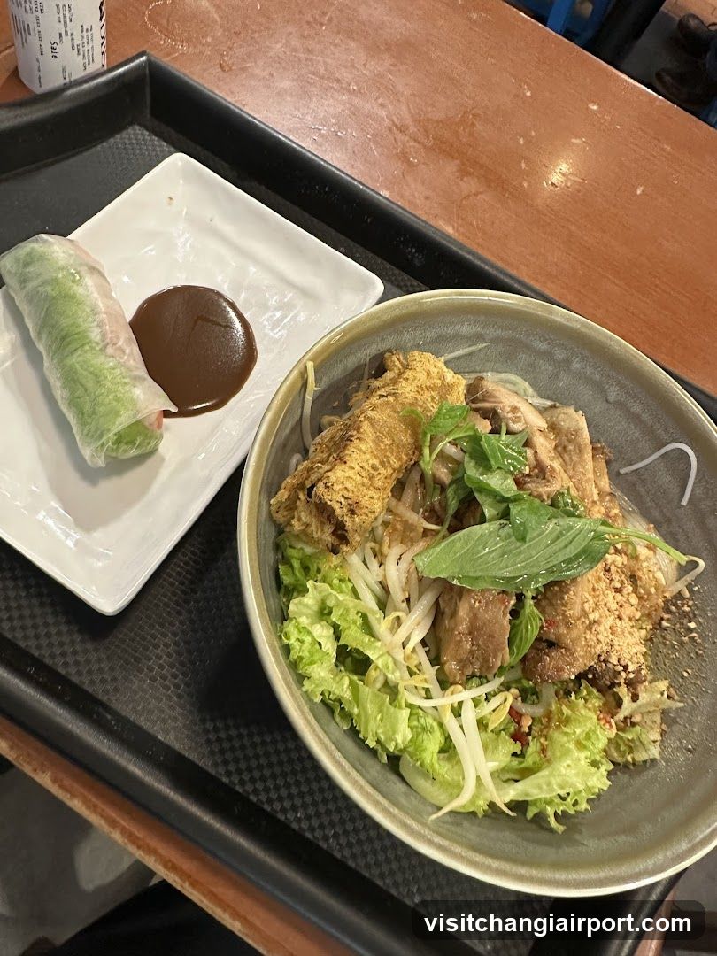 Vietnamese-style noodle dish with spring roll