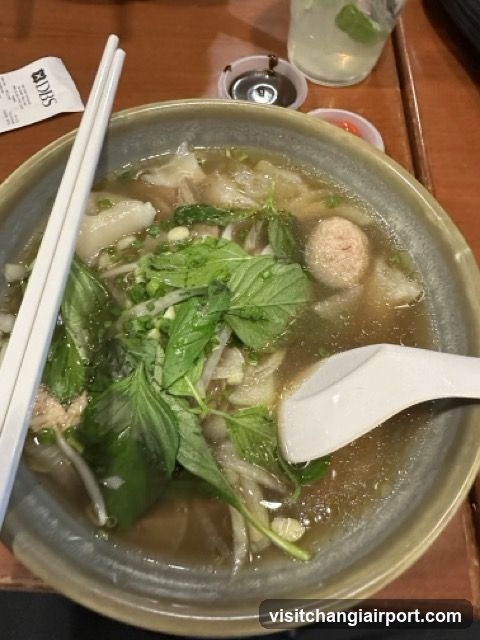 Bowl of Soup with Basil and Meatballs