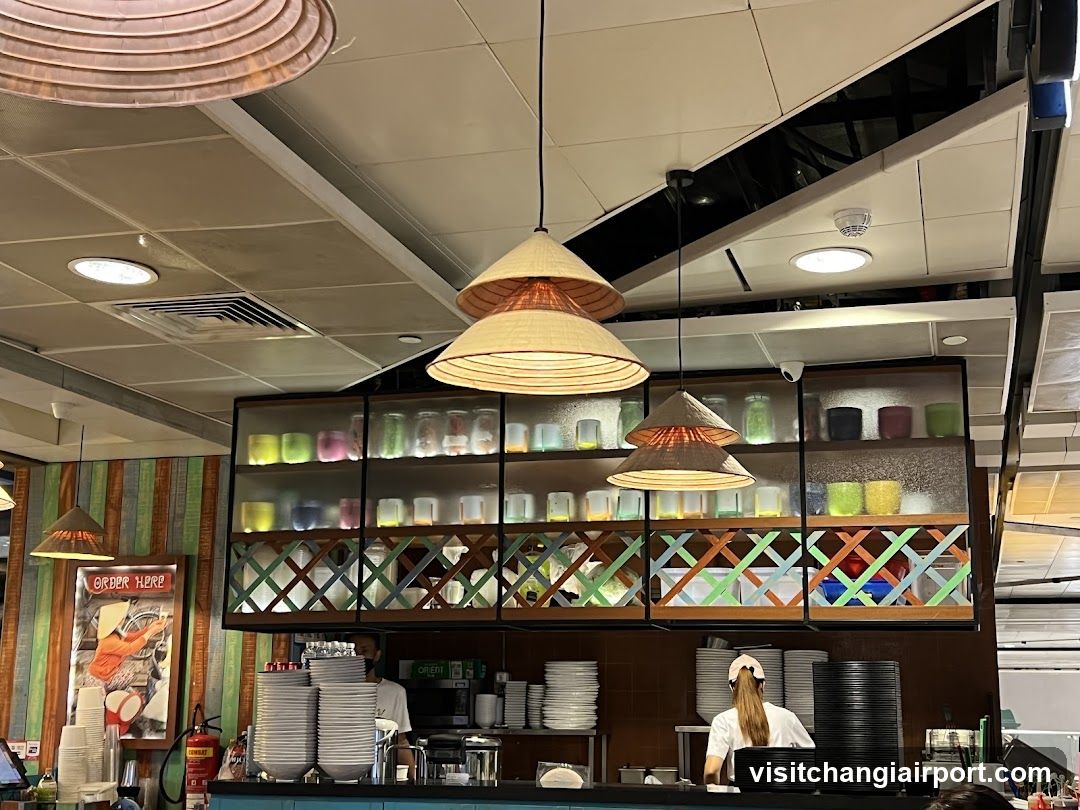 Restaurant Interior with Hanging Lamps and Staff