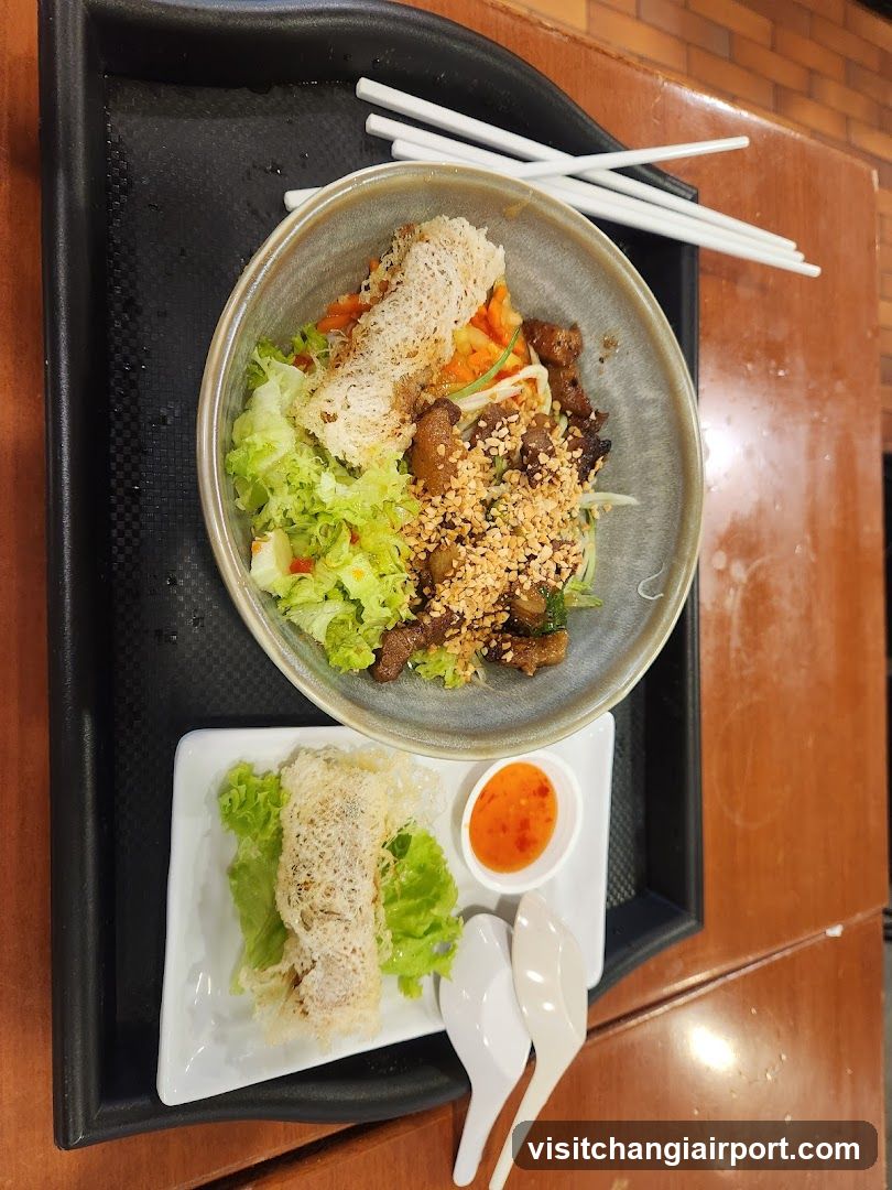 Bowl of food with side dish and dipping sauce