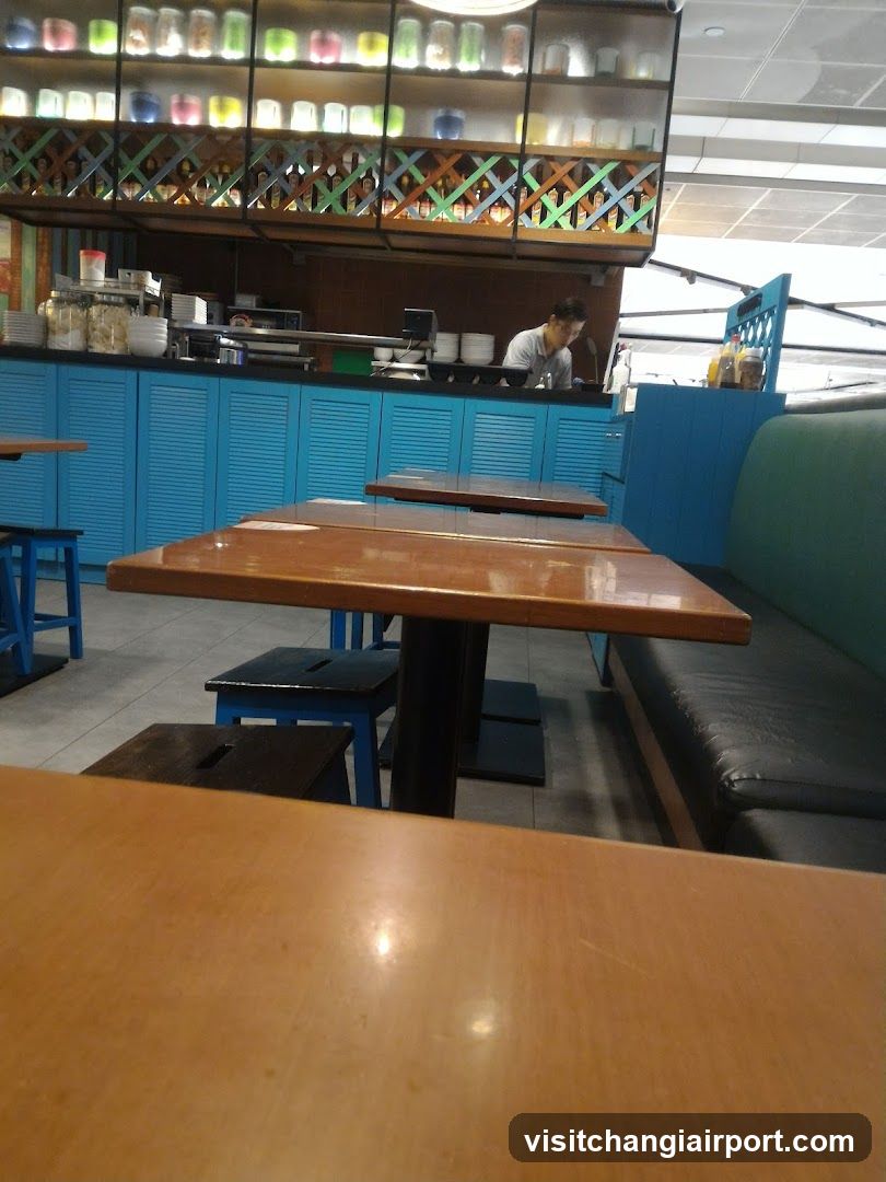 Restaurant Interior with Blue Cabinets and Wooden Tables