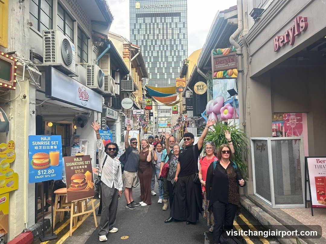Street scene with group of people posing in a narrow alleyway