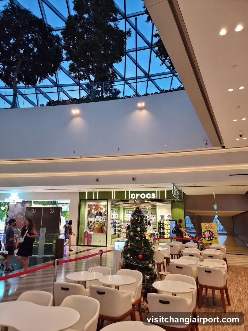 Shopping Mall Interior with Crocs Store and Christmas Tree