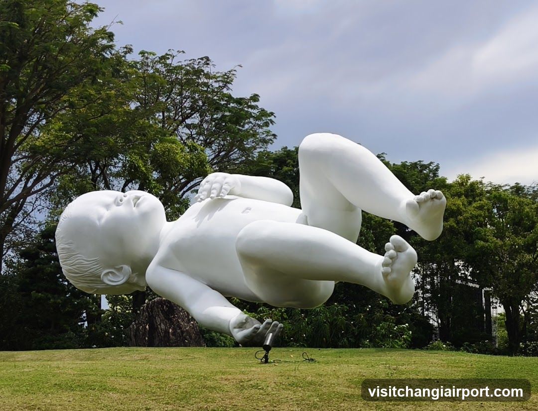 White Baby Sculpture in Park
