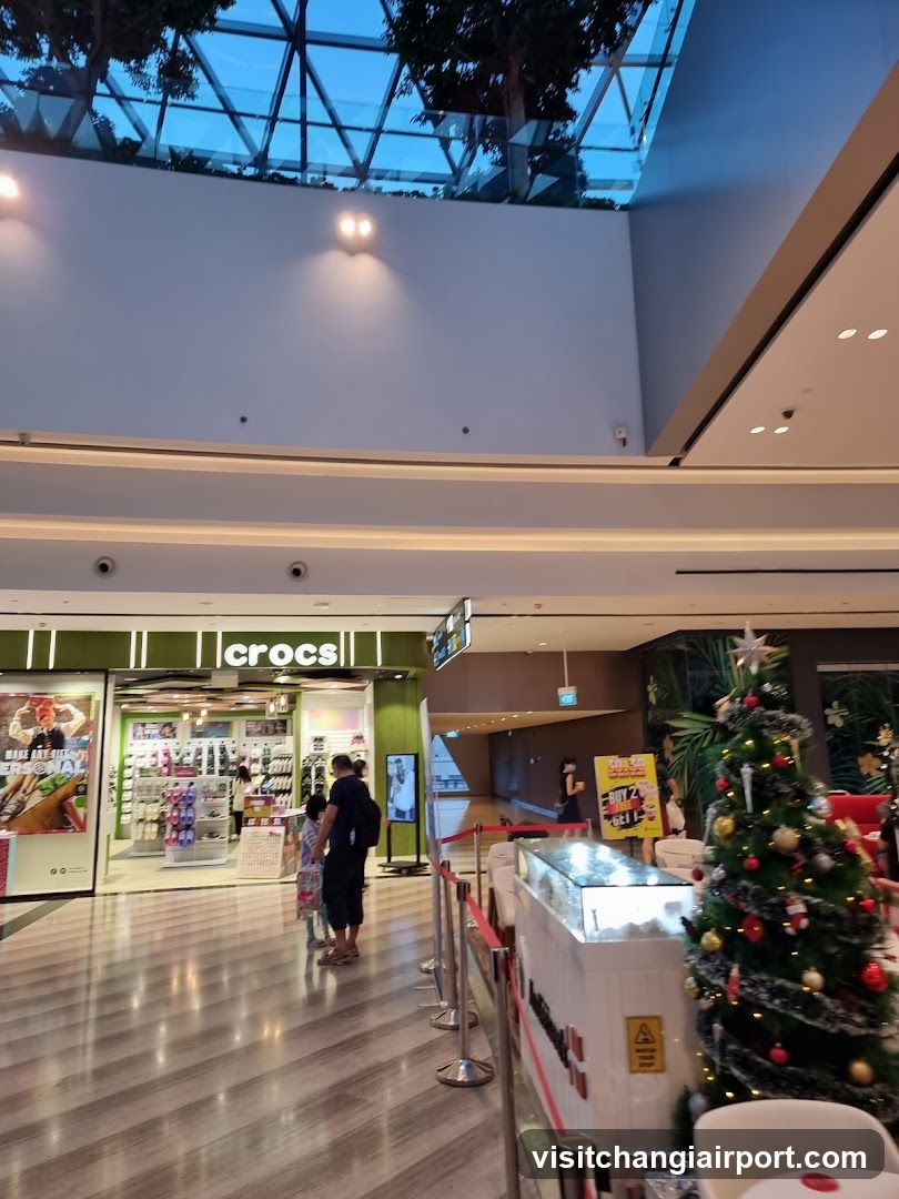 Shopping Mall Interior with Crocs Store and Christmas Tree