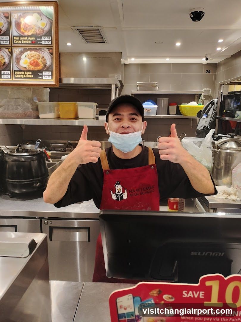 Staff in Kitchen Giving Thumbs Up