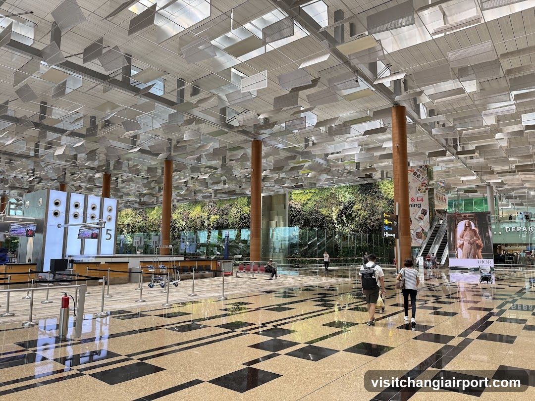 Airport Terminal Interior with Check-in Area and Green Wall