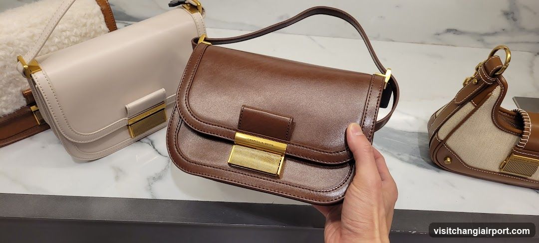 Handheld Brown Leather Handbag with Gold Hardware