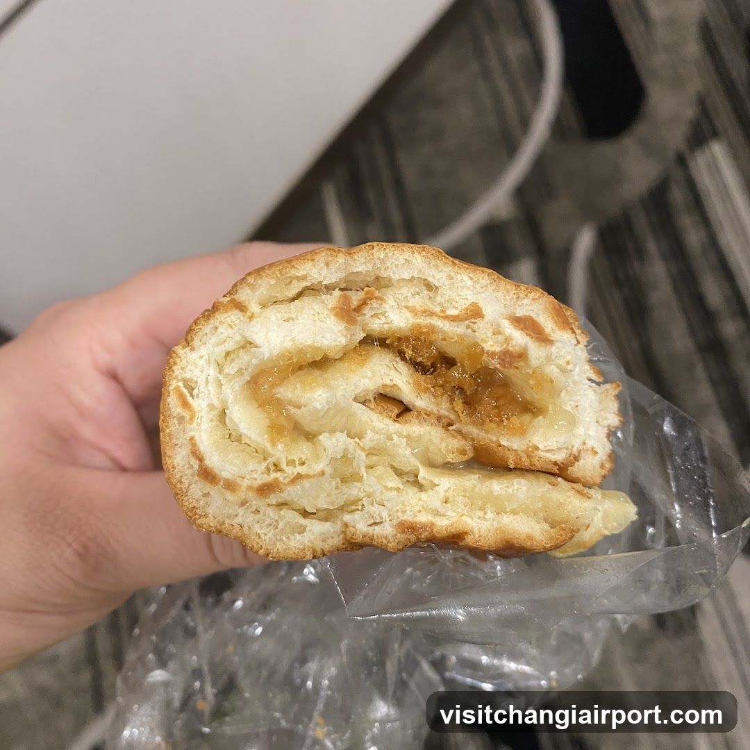 Hand holding a pastry