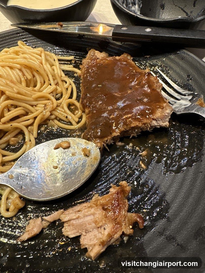 Half-eaten meal on dark plate