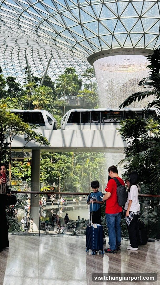Airport Terminal Interior with Waterfall and Monorail