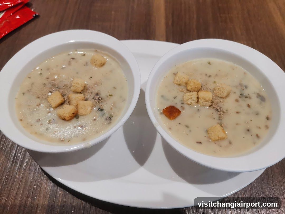 Two Bowls of Creamy Soup with Croutons