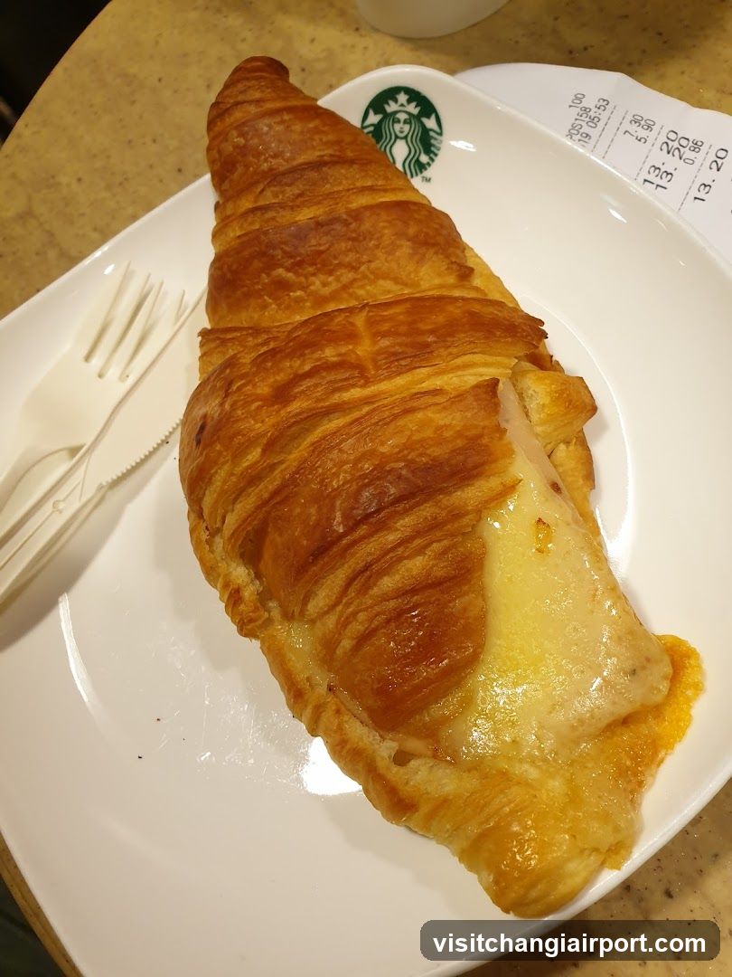 Croissant with Cheese on Starbucks Plate