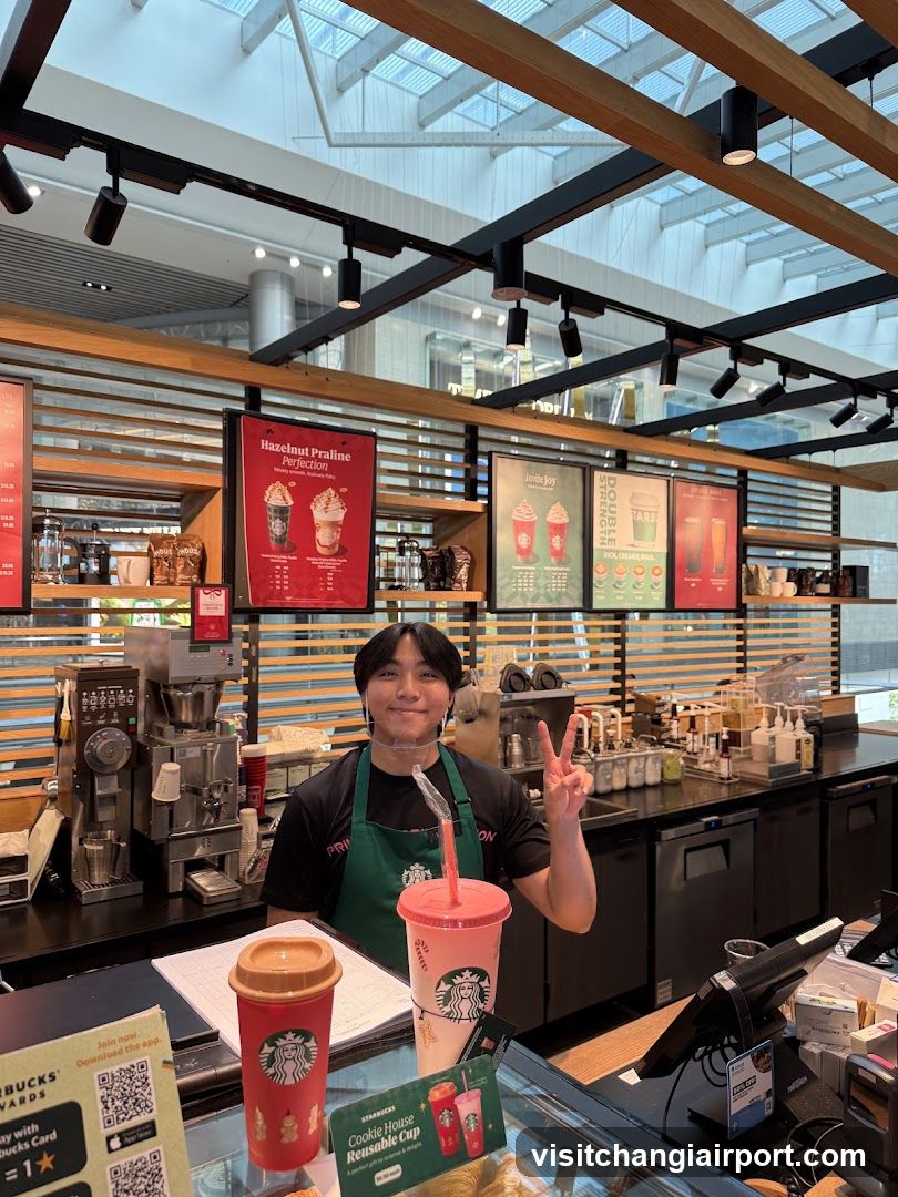 Starbucks Barista with Drinks