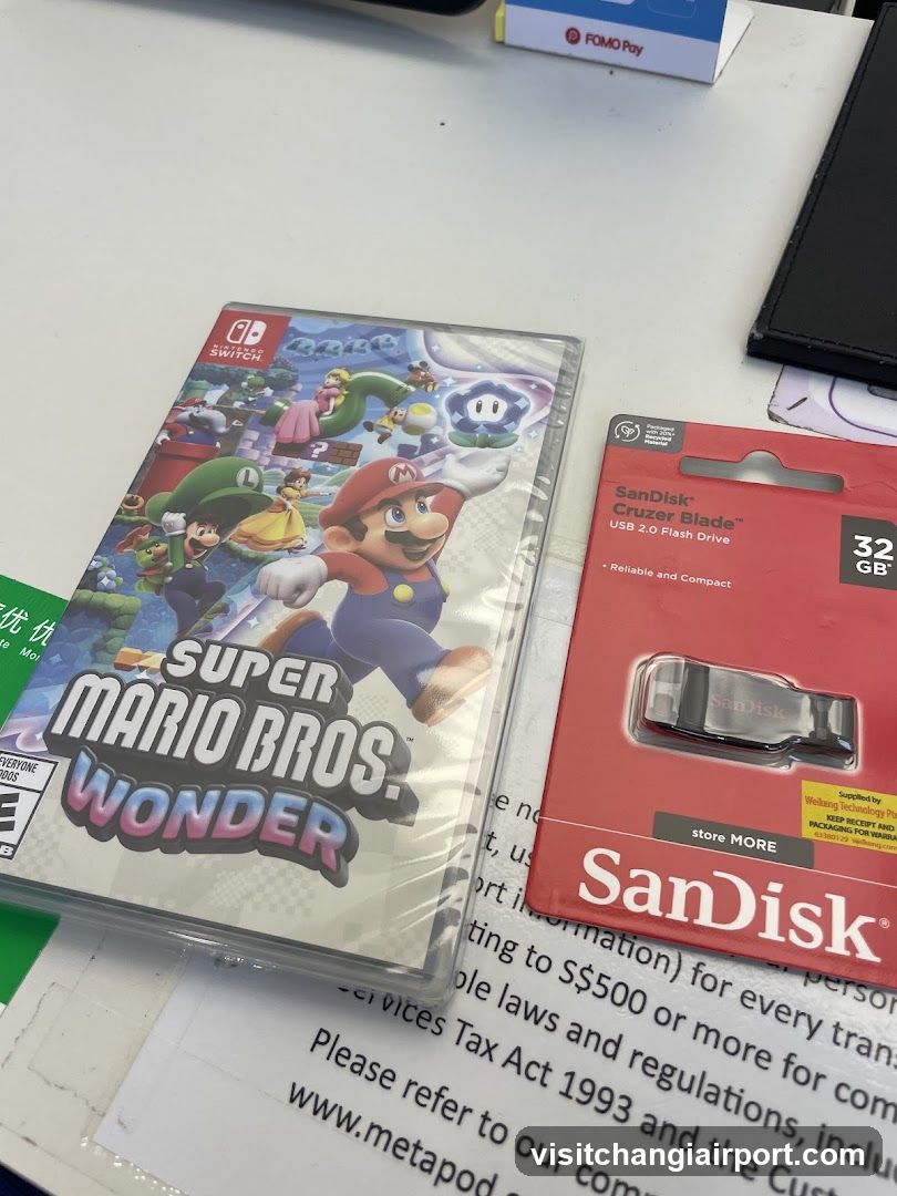 Super Mario Bros Wonder and SanDisk Flash Drive on table
