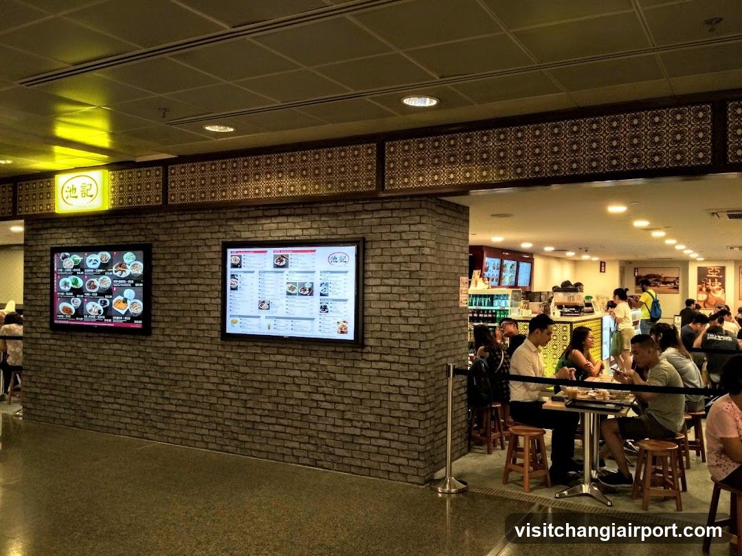 Restaurant Interior with Menu Boards and Patrons