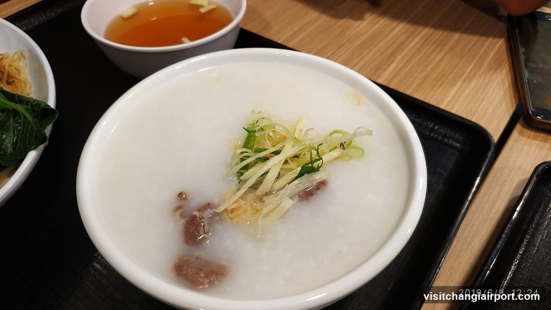 Congee with toppings and side dishes