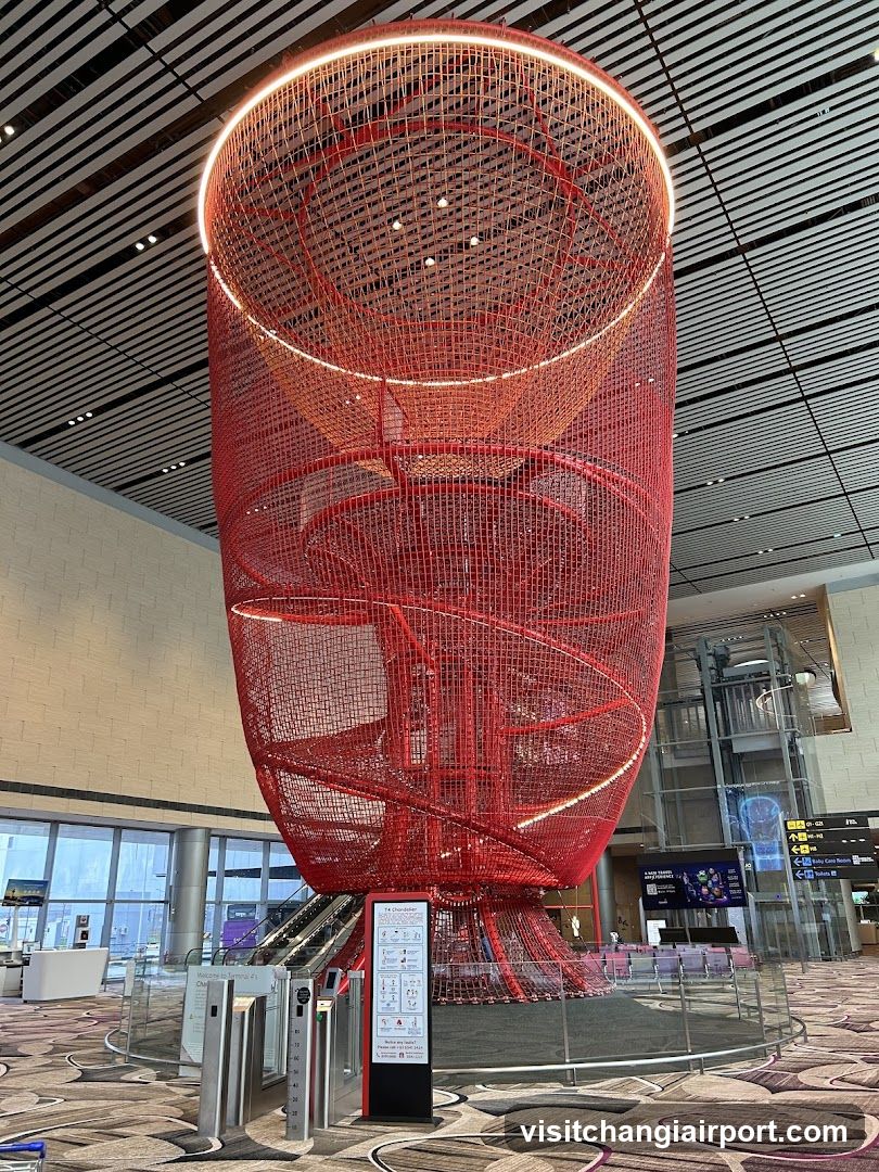 Red Spiral Art Installation in Airport Terminal