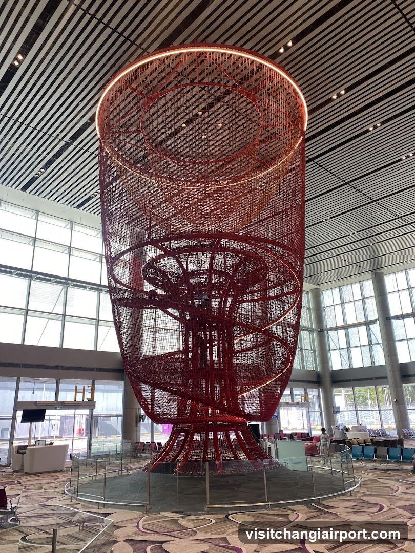 Red Spiral Sculpture in Airport Terminal