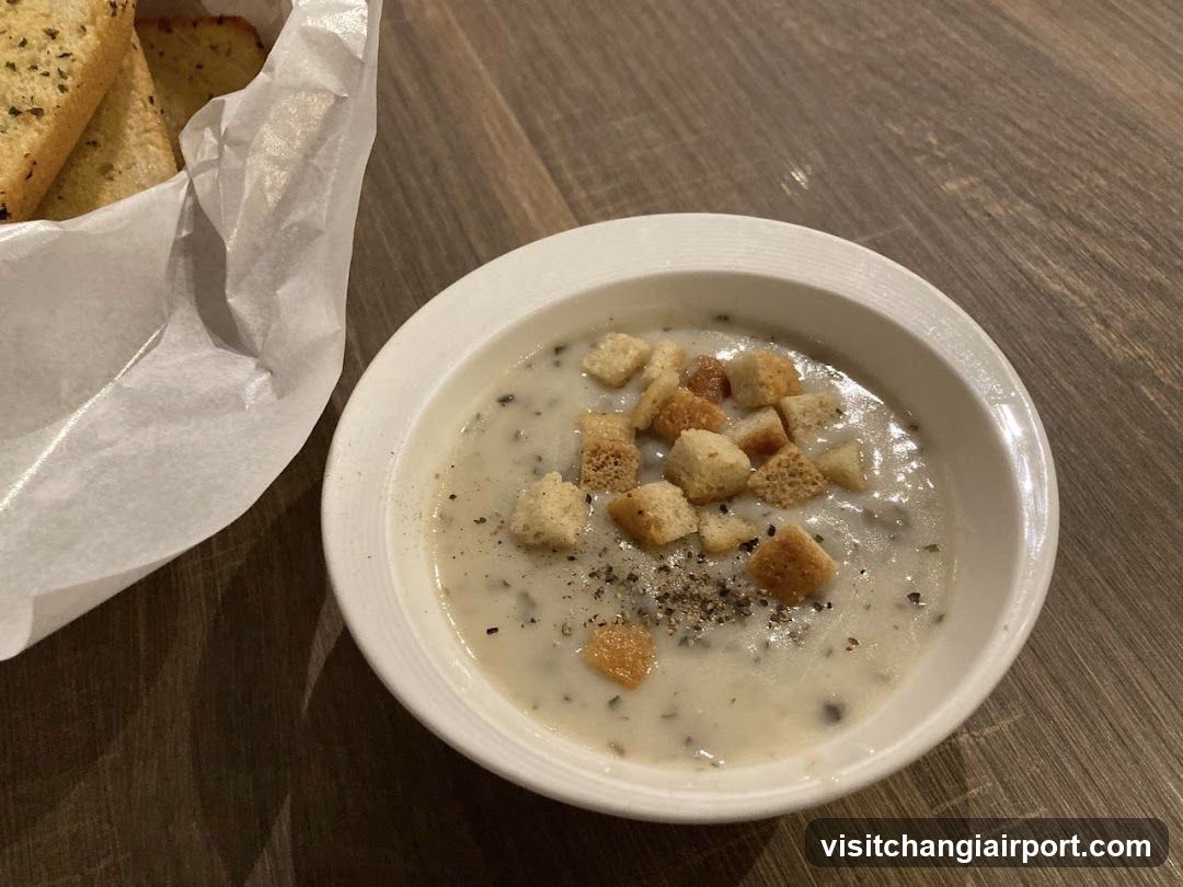Creamy Soup with Croutons and Garlic Bread