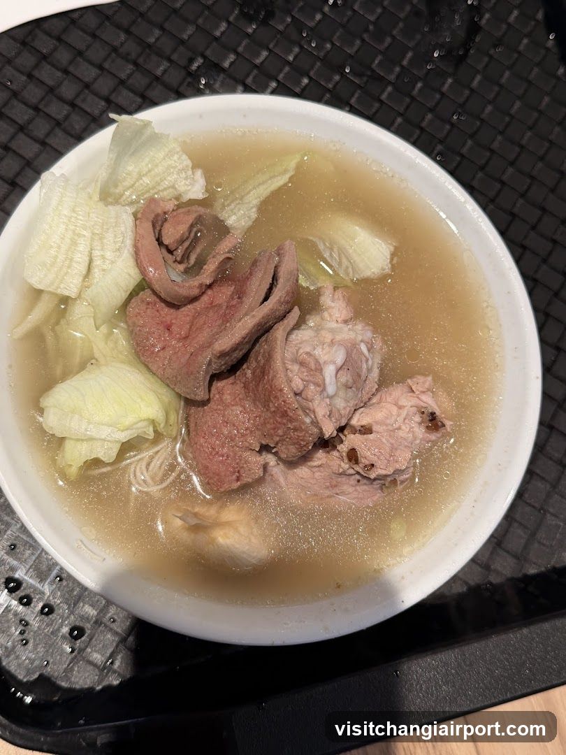 Bowl of Soup with Meat and Vegetables