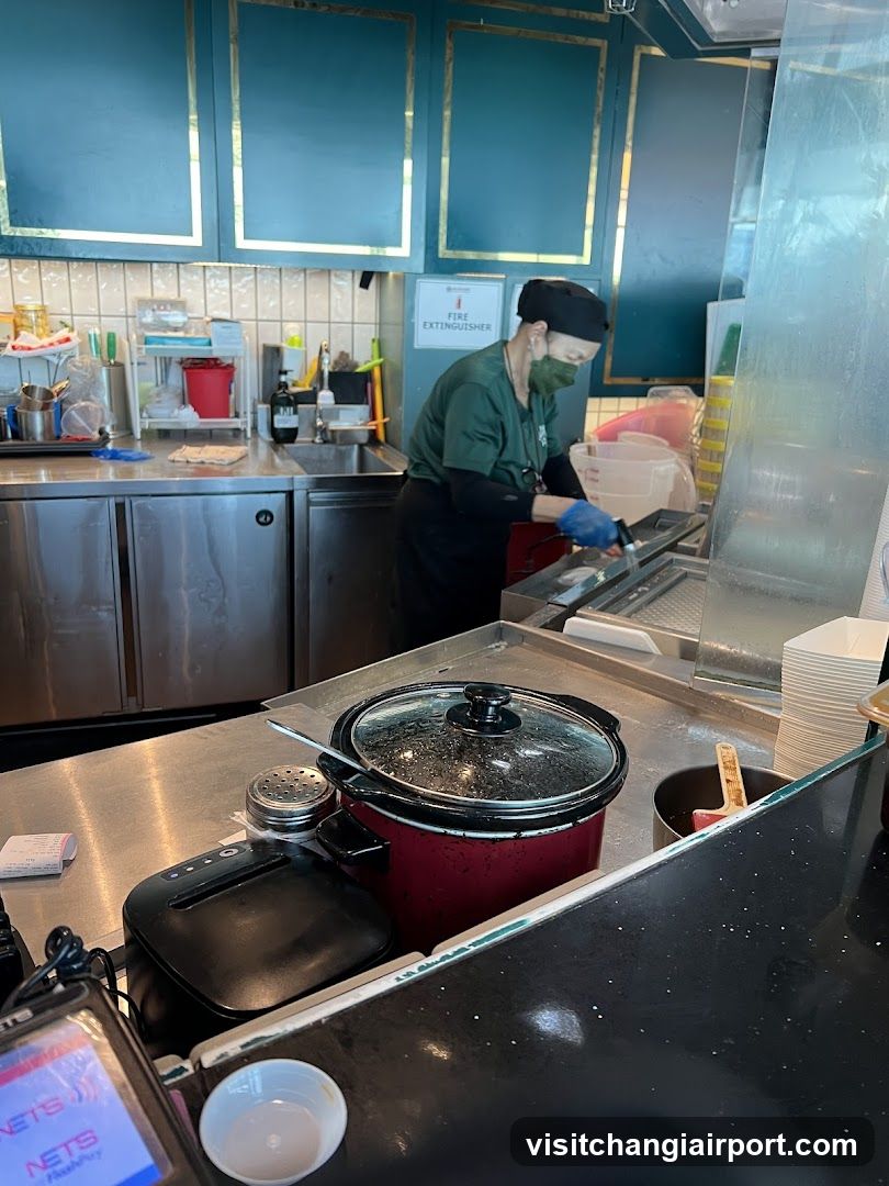 Kitchen Interior with Staff Preparing Food