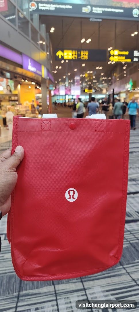 Lululemon bag in airport terminal