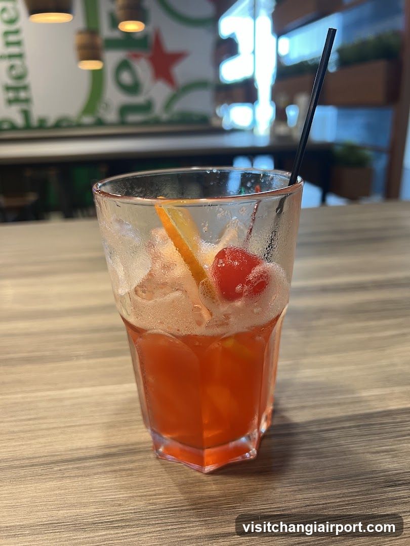 Orange Cocktail with Cherry and Orange Slice