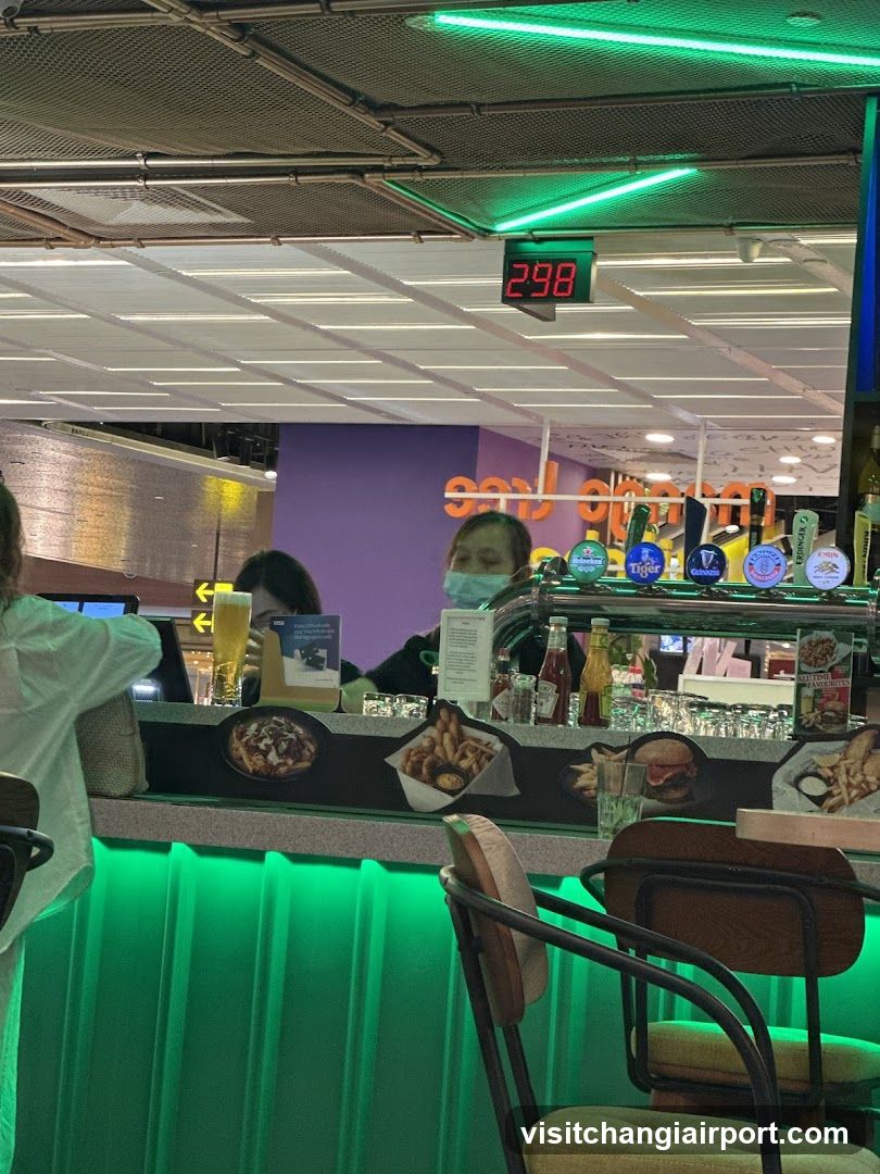 Bar Interior with Staff and Digital Clock