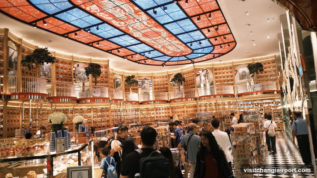 Interior of a bustling shop with vibrant ceiling art