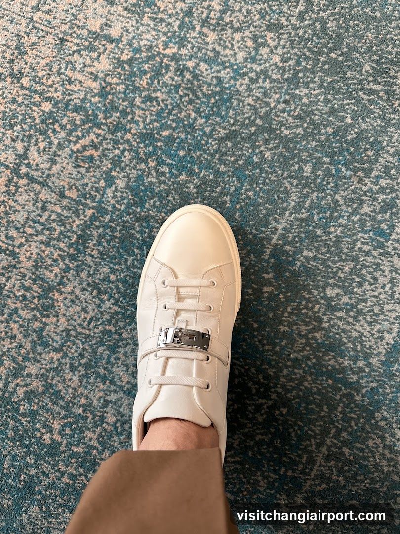 White Sneaker on Patterned Carpet
